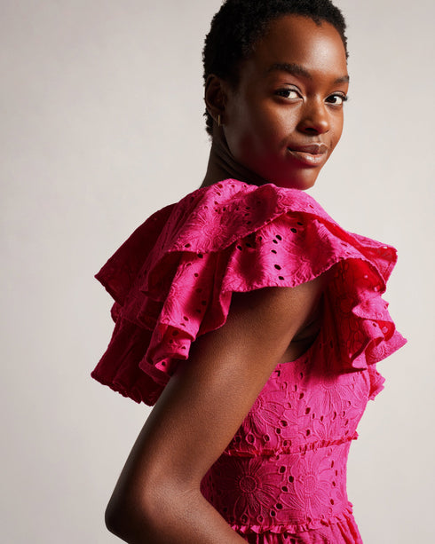 MIRZA-Dresses-Every day is a fashion show in MIRZA. Featuring a delicate broderie design and playful ruffles, this midi dress was made for strutting your stuff through the bustling city streets. Whether you're sipping lattes at a chic café, indulging in retail therapy, or embarking on a romantic rendezvous, this dress guarantees an unforgettable entrance.The fabric of this product is made of 100% organic cotton. Organic cotton has a proven lower environmental impact than conventional cotton, as it reduces